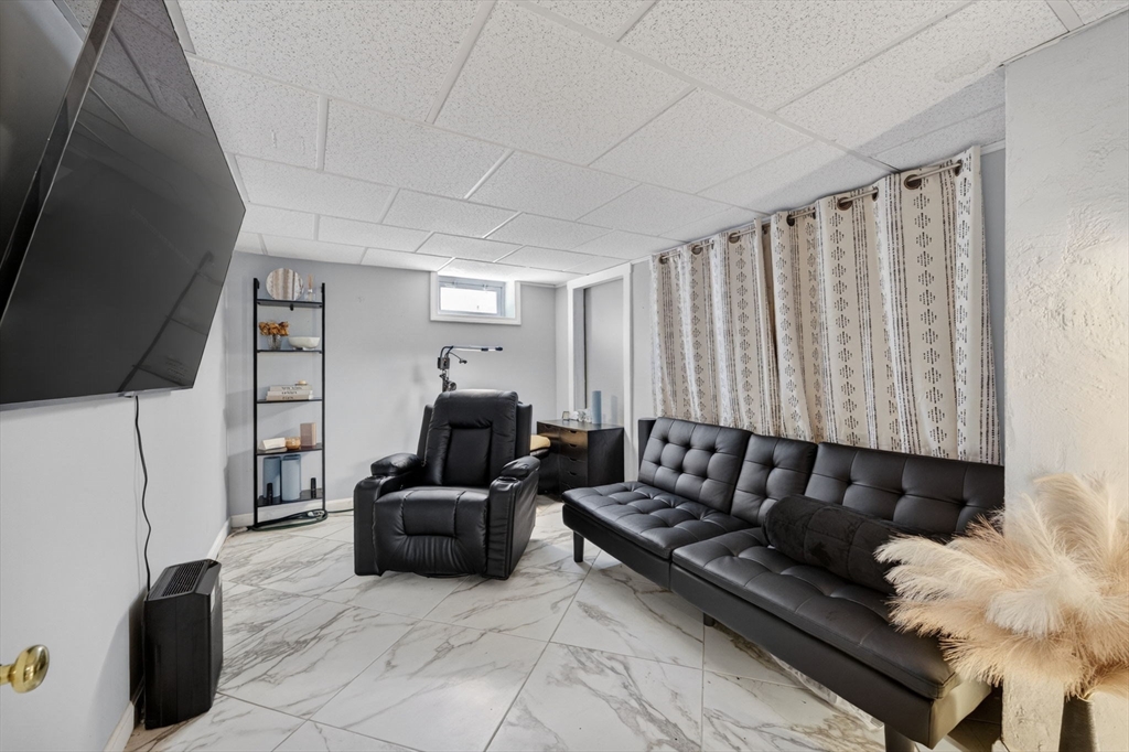 114 Lovell Street Worcester, MA 01603 - Photo 21 of 32 a living room with furniture and a flat screen tv