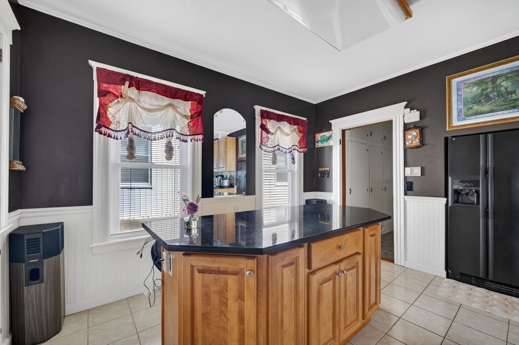 114 Lovell Street Worcester, MA 01603 - Photo 7 of 32 a kitchen with stainless steel appliances granite countertop a refrigerator and a sink