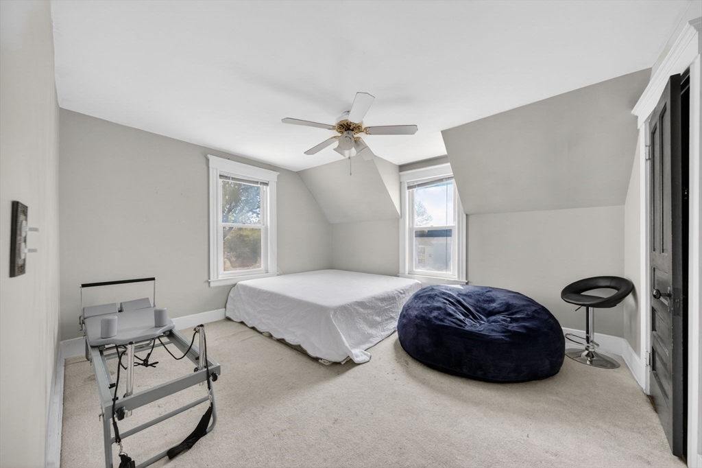 114 Lovell Street Worcester, MA 01603 - Photo 10 of 32 a bedroom with a bed and a window