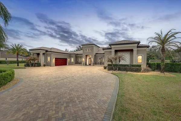 a front view of house with yard and green space