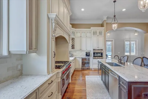 a view of a livingroom with furniture window and wooden floor