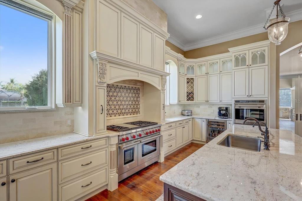 2620 Tylers Riv Run Lutz, FL 33559 - Photo 22 of 87 a kitchen with stainless steel appliances granite countertop a stove top oven a sink a counter space and cabinets