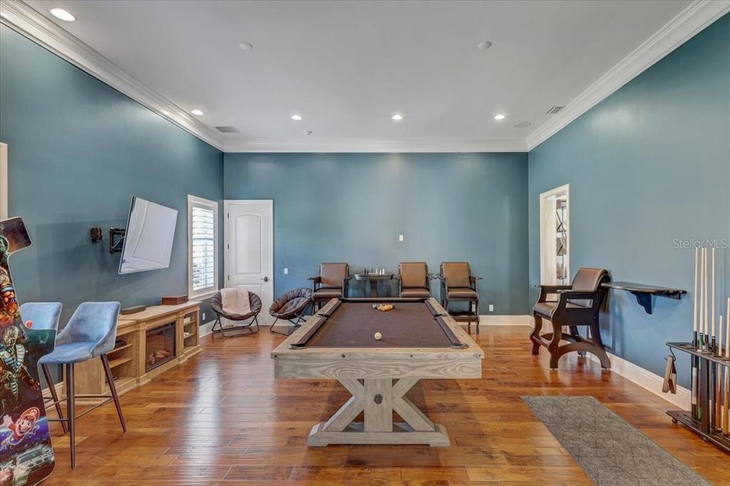 2620 Tylers Riv Run Lutz, FL 33559 - Photo 26 of 87 a room with lots of chairs and wooden floor