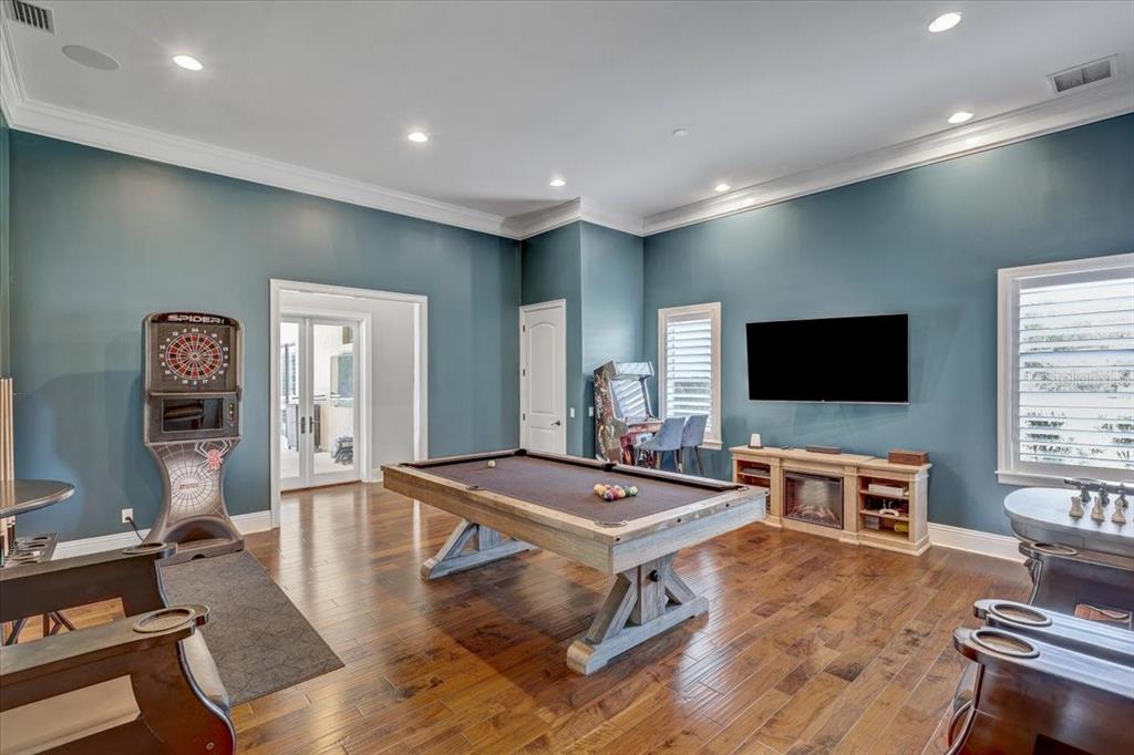 2620 Tylers Riv Run Lutz, FL 33559 - Photo 27 of 87 a living room with furniture a flat screen tv and kitchen view