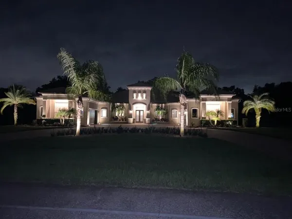 a view of house with outdoor space and sitting area
