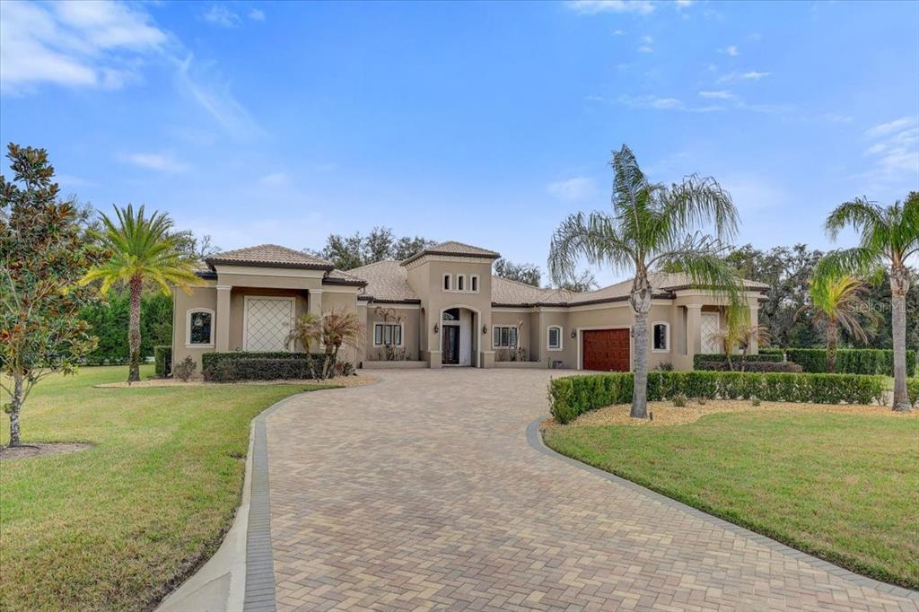 2620 Tylers Riv Run Lutz, FL 33559 - Photo 5 of 87 a front view of a house with a yard and garage