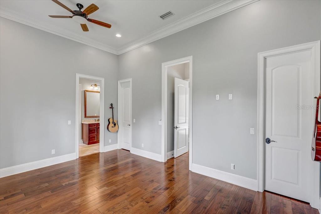 2620 Tylers Riv Run Lutz, FL 33559 - Photo 56 of 87 a view of a livingroom with wooden floor and a ceiling fan