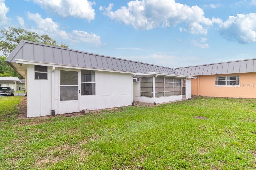 11723 Boynton Lane, Unit 1 New Port Richey, FL 34654 - Photo 21 of 31 a view of a back yard of the house