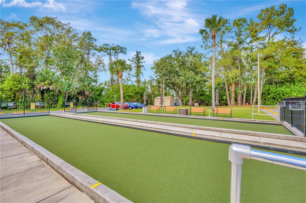 11723 Boynton Lane, Unit 1 New Port Richey, FL 34654 - Photo 27 of 31 a building with trees in the background