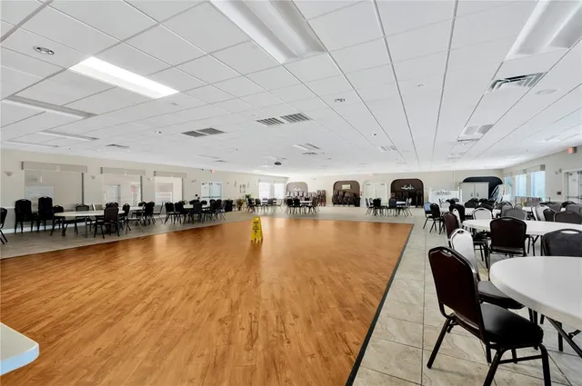 a living room with lots of furniture and a swimming pool