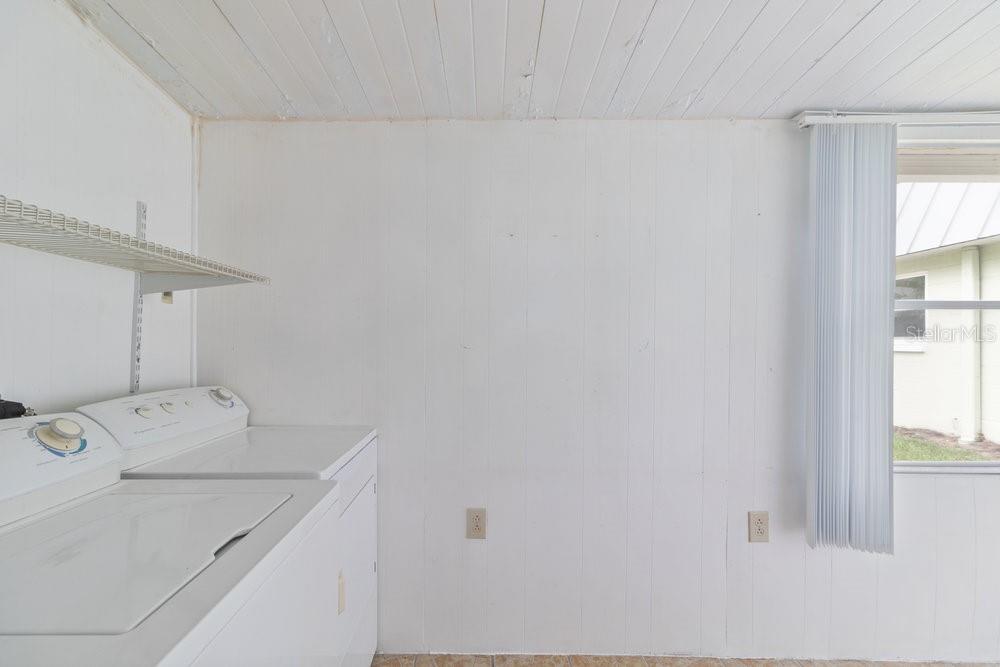 11723 Boynton Lane, Unit 1 New Port Richey, FL 34654 - Photo 9 of 31 a utility room with dryer and washer