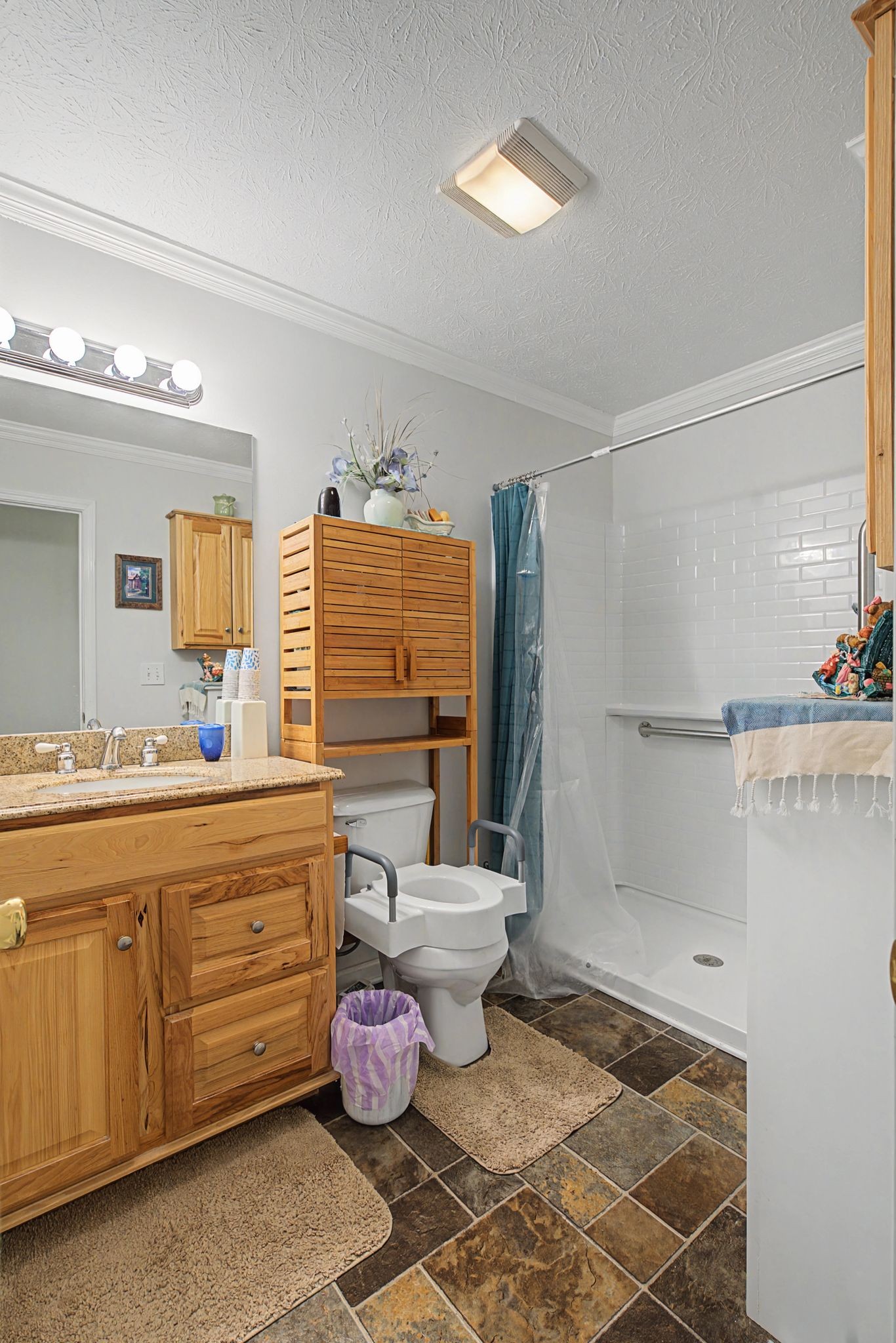 1075 Coker Ford Road Portland, TN 37148 - Photo 22 of 35 a bathroom with a sink mirror and toilet