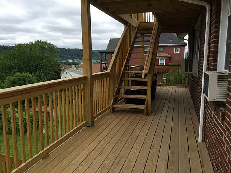 407 Elm Road Ambridge, PA 15003 - Photo 4 of 25 Patio/Deck. 1st fl unit back deck