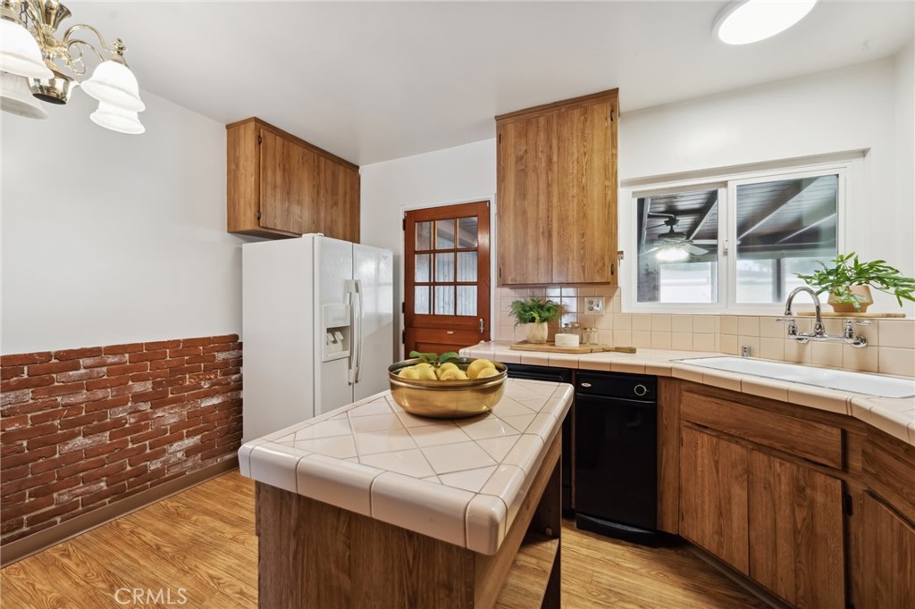 3035 Priscilla Street Riverside, CA 92506 - Photo 12 of 45 a kitchen with a sink and cabinets
