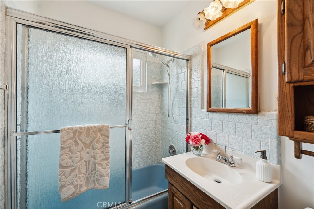 3035 Priscilla Street Riverside, CA 92506 - Photo 17 of 45 a bathroom with a sink and a mirror