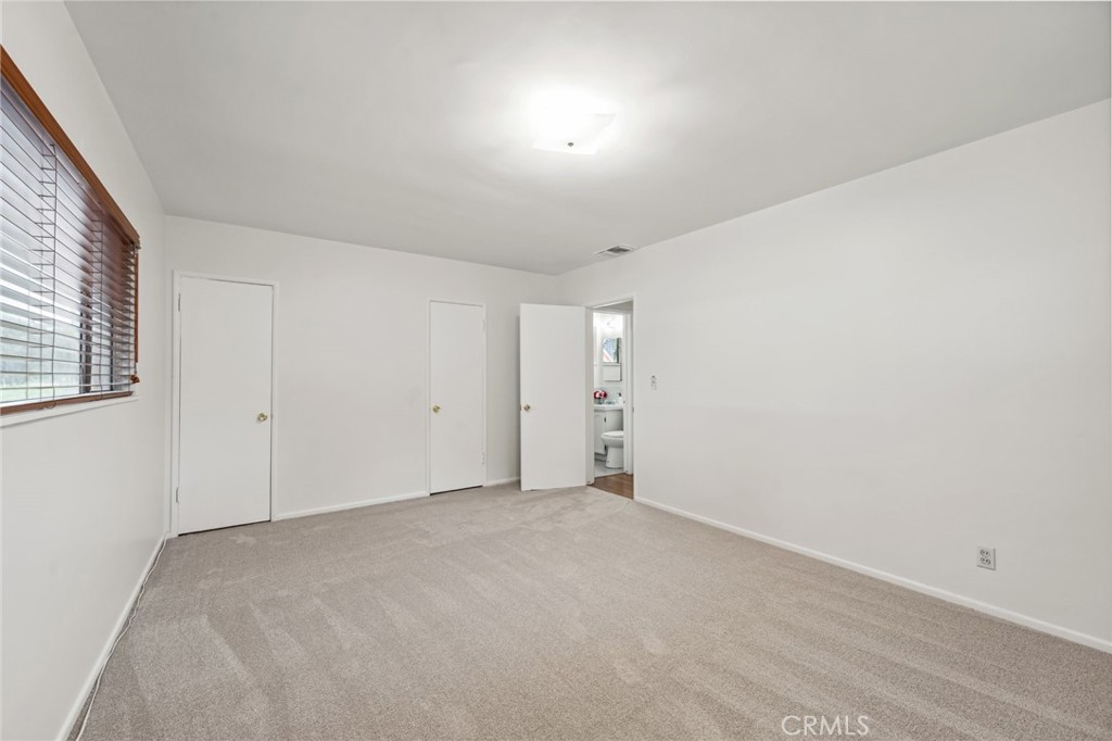 3035 Priscilla Street Riverside, CA 92506 - Photo 19 of 45 an empty room with a empty space and windows