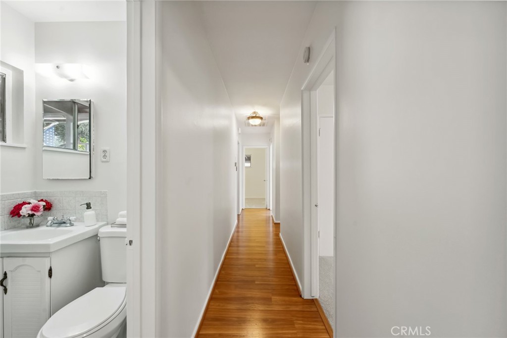 3035 Priscilla Street Riverside, CA 92506 - Photo 21 of 45 a view of a hallway with wooden floor and workspace