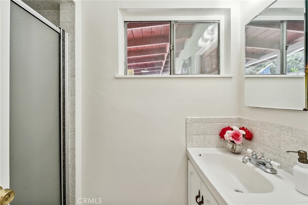 3035 Priscilla Street Riverside, CA 92506 - Photo 23 of 45 a bathroom with a sink and a mirror