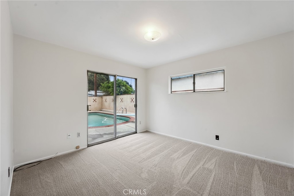 3035 Priscilla Street Riverside, CA 92506 - Photo 26 of 45 a view of room with window and ceiling fan