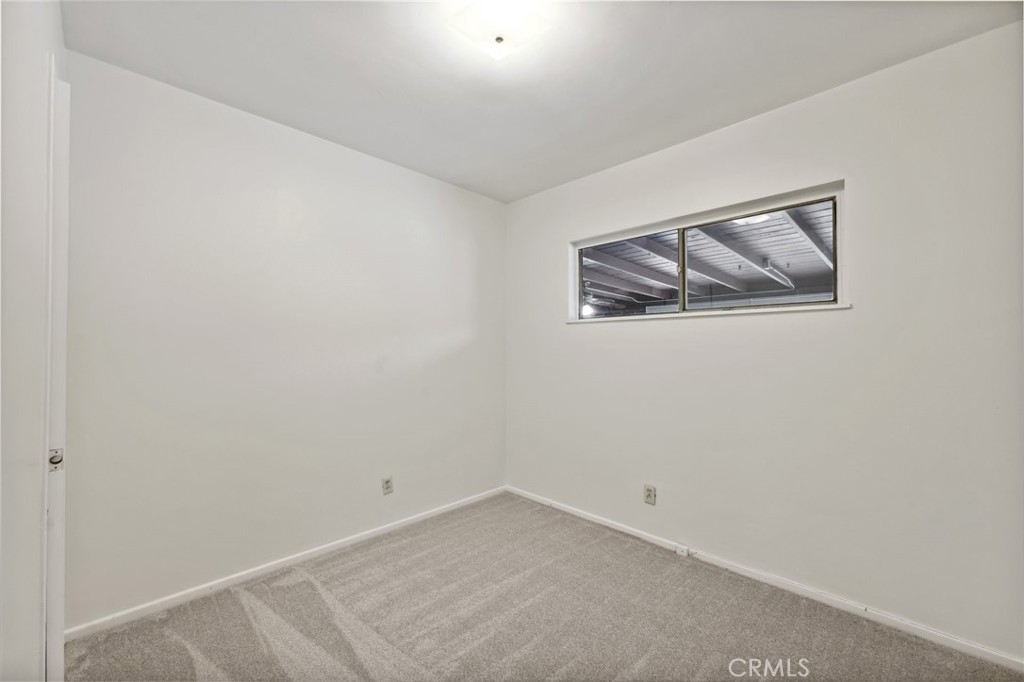 3035 Priscilla Street Riverside, CA 92506 - Photo 27 of 45 an empty room with a painting on the wall