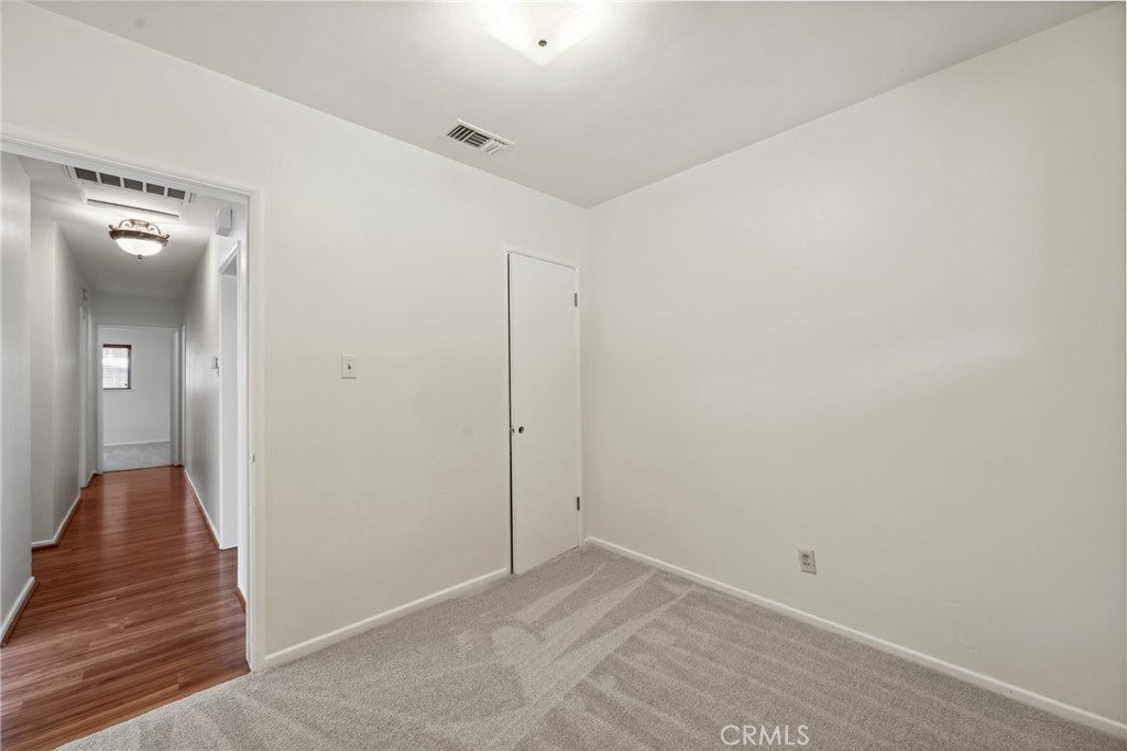 3035 Priscilla Street Riverside, CA 92506 - Photo 28 of 45 a view of a hallway with wooden floor and staircase