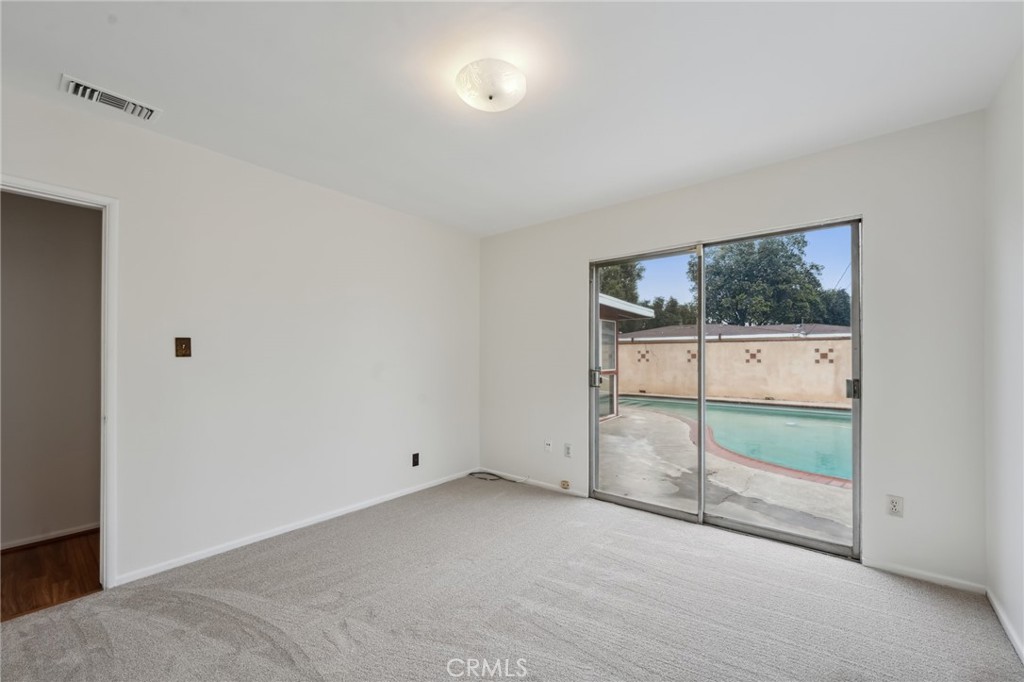 3035 Priscilla Street Riverside, CA 92506 - Photo 29 of 45 an empty room with sliding door
