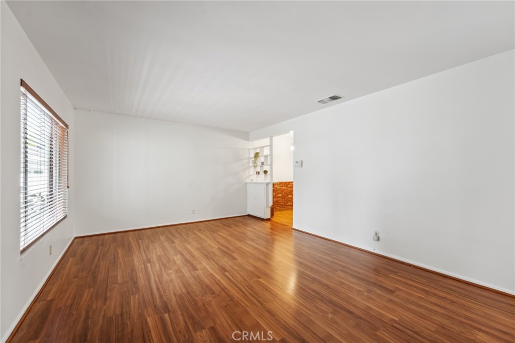 3035 Priscilla Street Riverside, CA 92506 - Photo 6 of 45 a view of empty room with wooden floor and fan