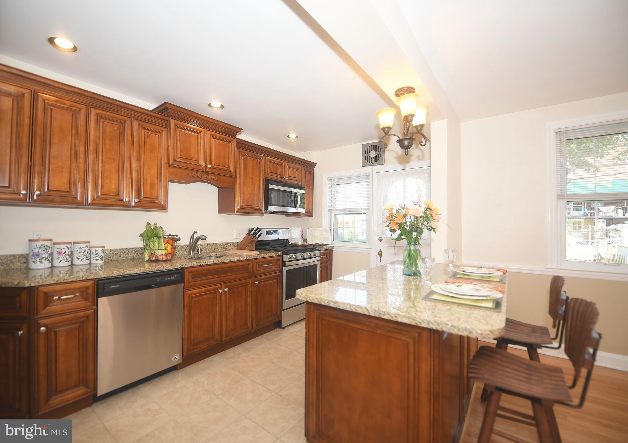 430 Stratford Road Baltimore, MD 21228 - Photo 12 of 35 Entertain and eat around this large kitchen island