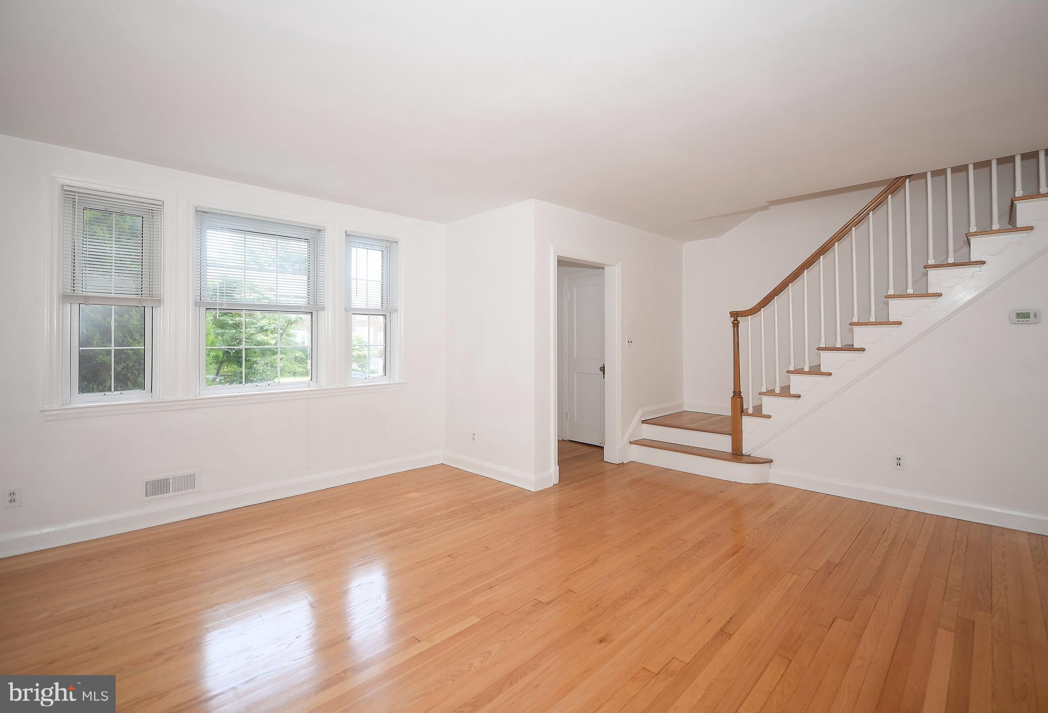 430 Stratford Road Baltimore, MD 21228 - Photo 8 of 35 Huge bright open living room leads upstairs