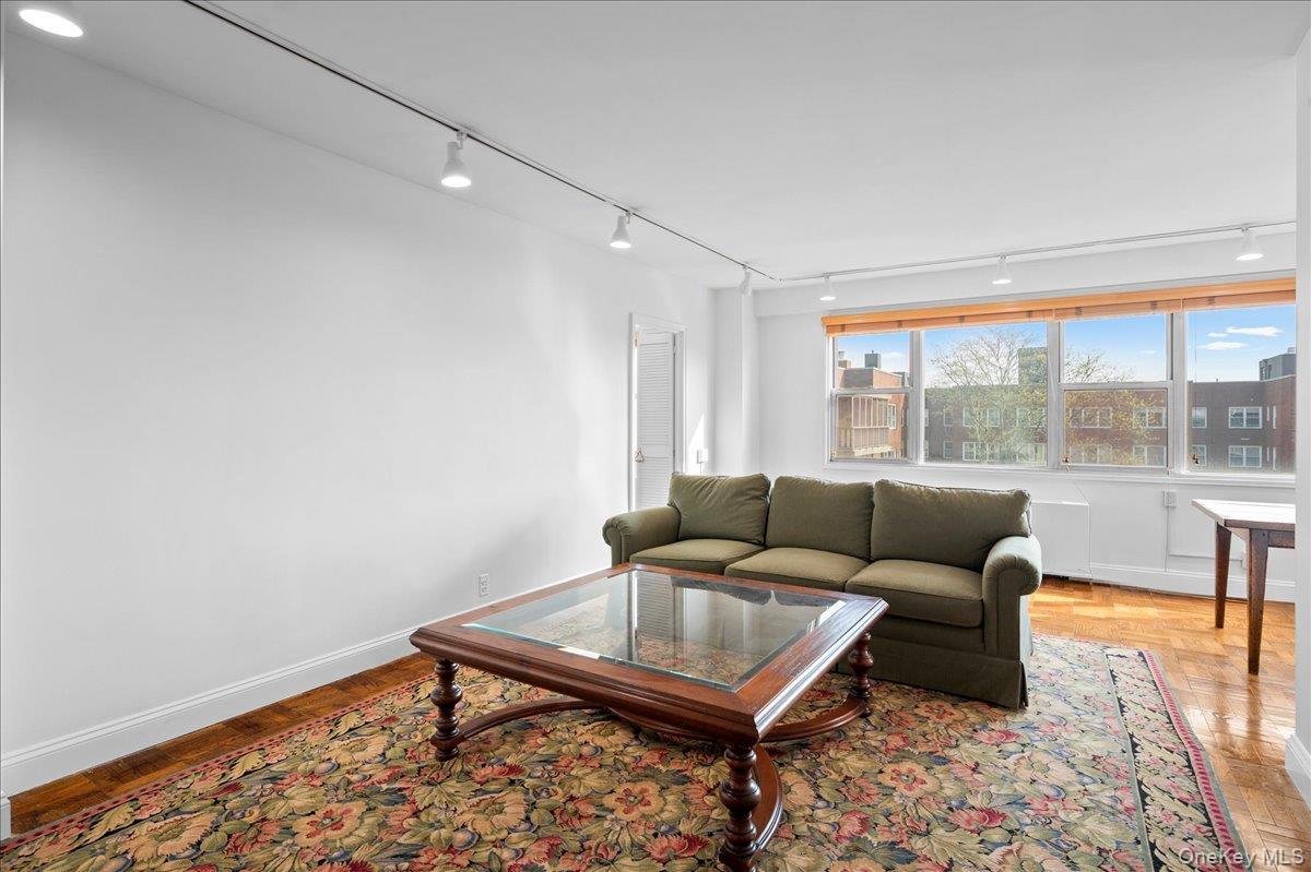 230 Garth Road, Unit 7D1 Scarsdale, NY 10583 - Photo 7 of 31 living room with lots of windows