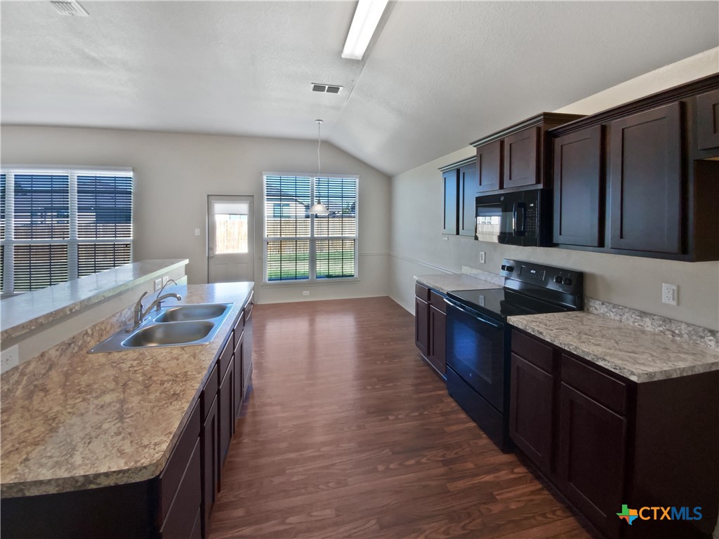 2501 Stoneham Temple, TX 76504 - Photo 6 of 19 a kitchen with stainless steel appliances granite countertop sink stove top oven and cabinets
