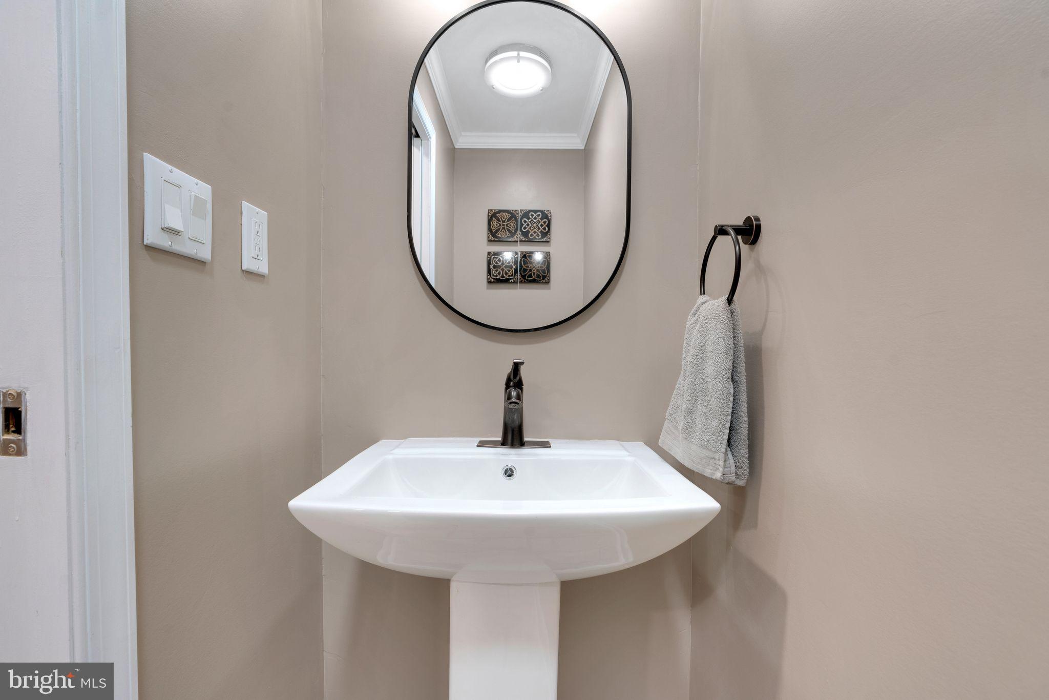3724 Queen Anne Bridge Road Davidsonville, MD 21035 - Photo 21 of 40 Half bathroom off great room and kitchen areas.