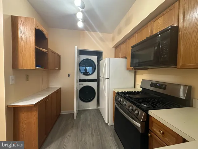 a kitchen with a stove and a microwave