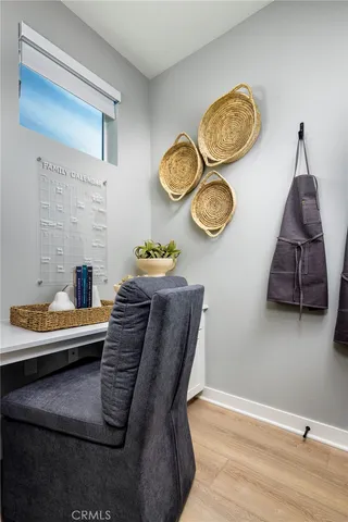 a view of a livingroom with furniture and wooden floor