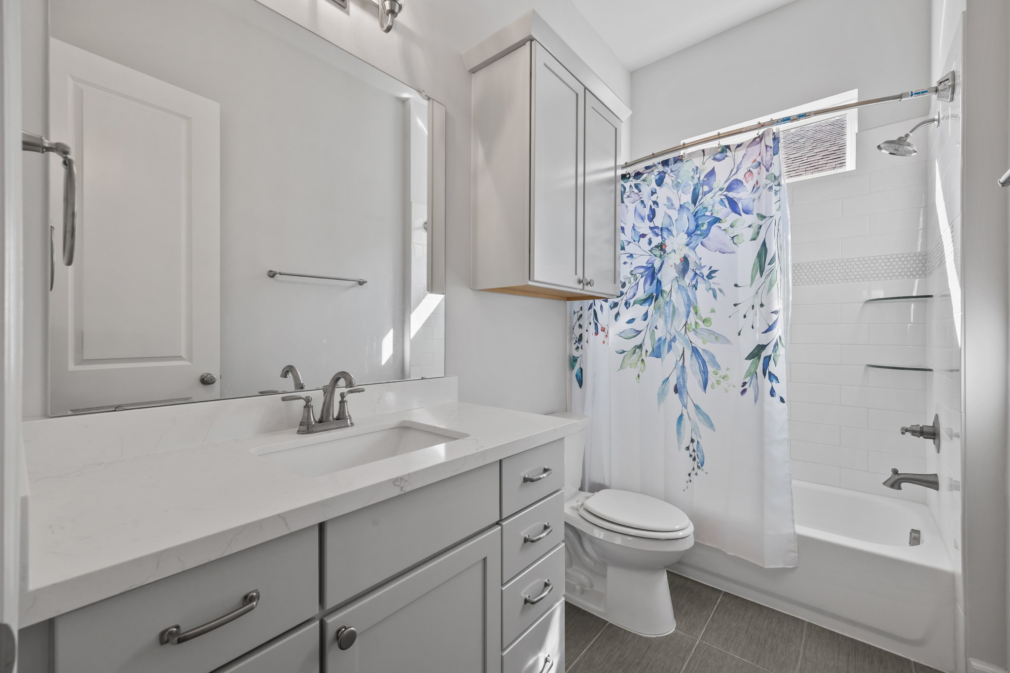 2505 South Houston Avenue Pearland, TX 77581 - Photo 15 of 24 a bathroom with a sink a toilet and shower