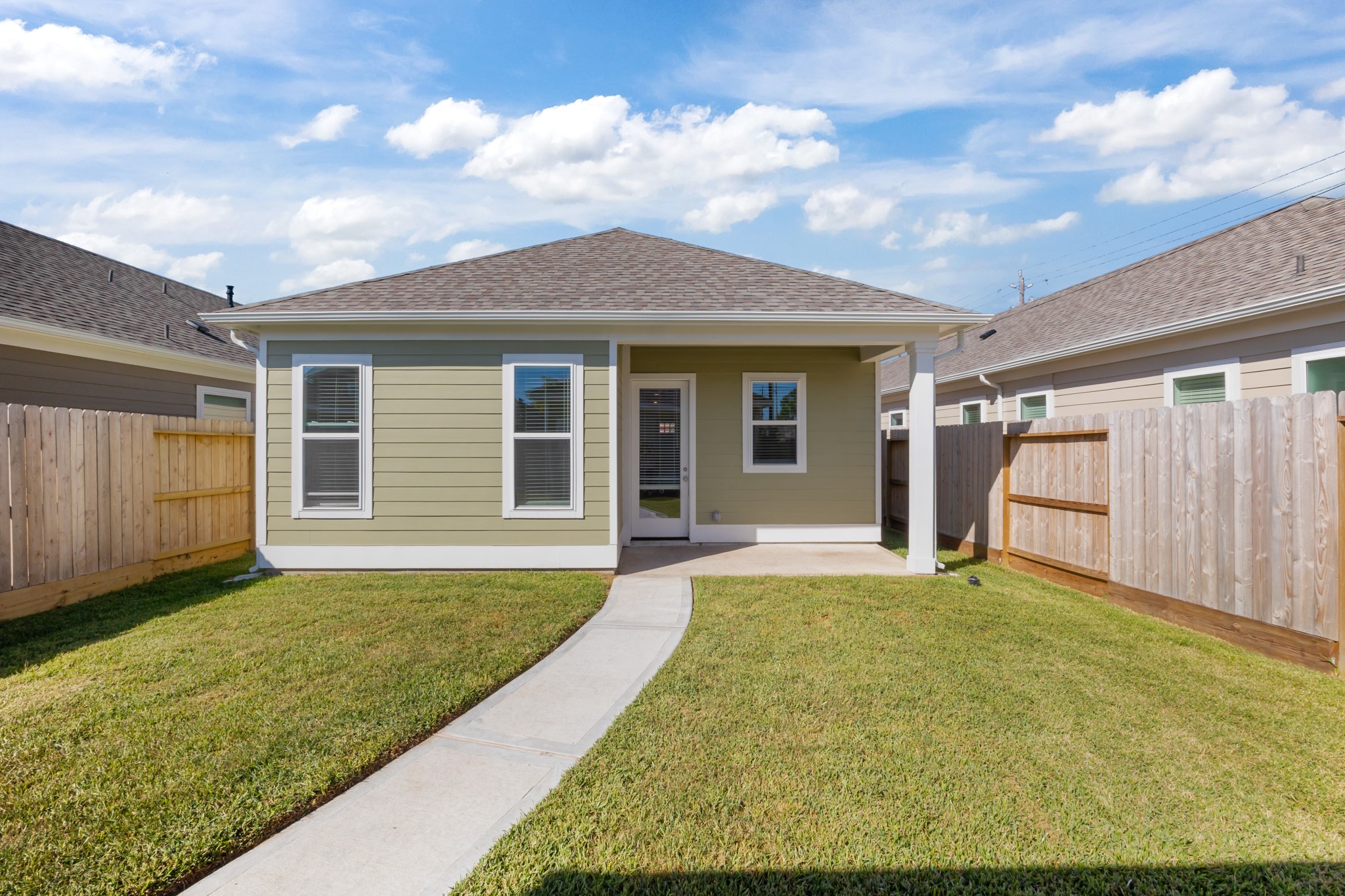 2505 South Houston Avenue Pearland, TX 77581 - Photo 19 of 24 a view of a backyard with a garden and garage