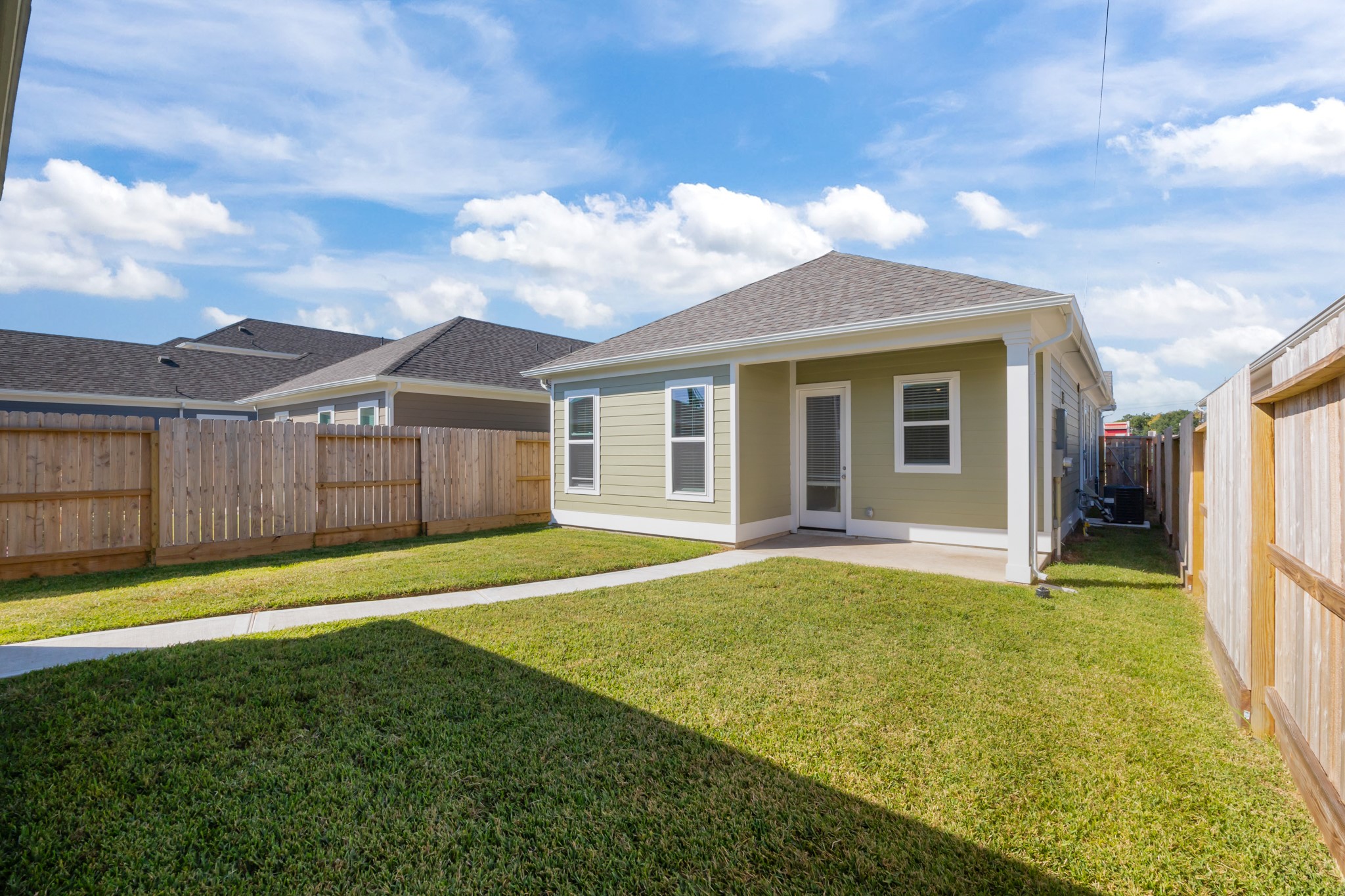 2505 South Houston Avenue Pearland, TX 77581 - Photo 20 of 24 a view of a backyard with a garden and plants
