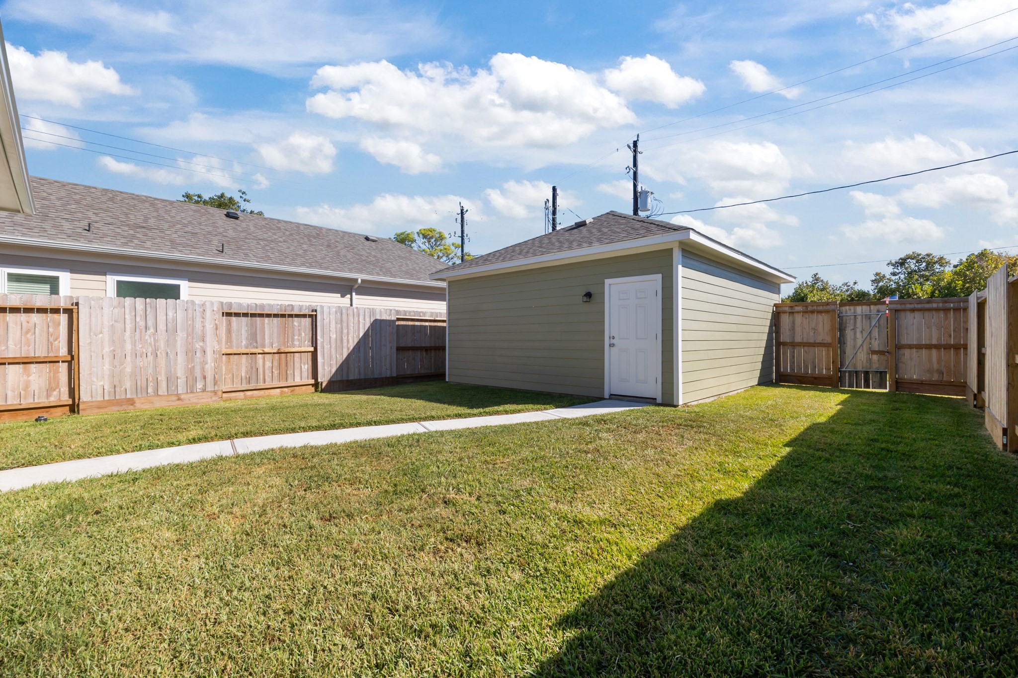 2505 South Houston Avenue Pearland, TX 77581 - Photo 21 of 24 a front view of a house with a yard