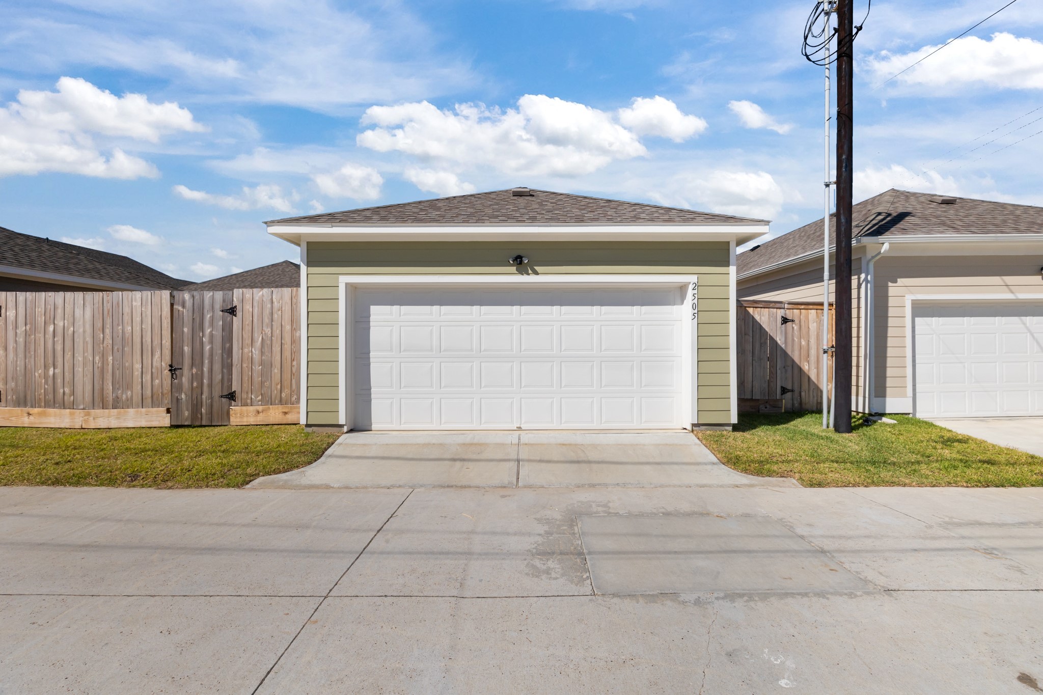 2505 South Houston Avenue Pearland, TX 77581 - Photo 23 of 24 a front view of a house with a yard and garage