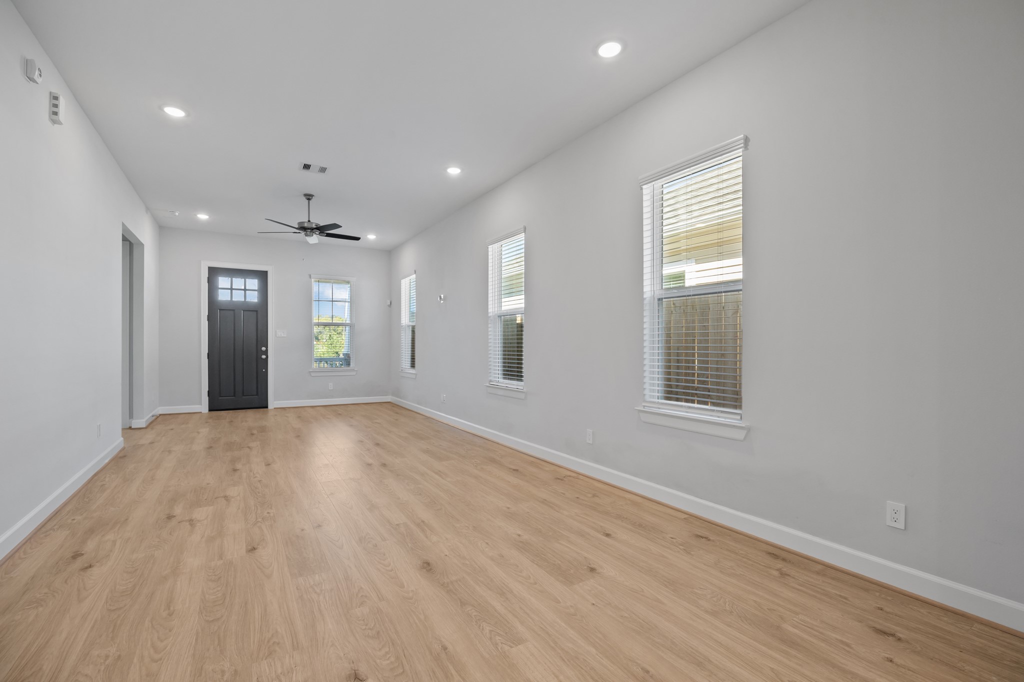 2505 South Houston Avenue Pearland, TX 77581 - Photo 3 of 24 an empty room with windows and entrance