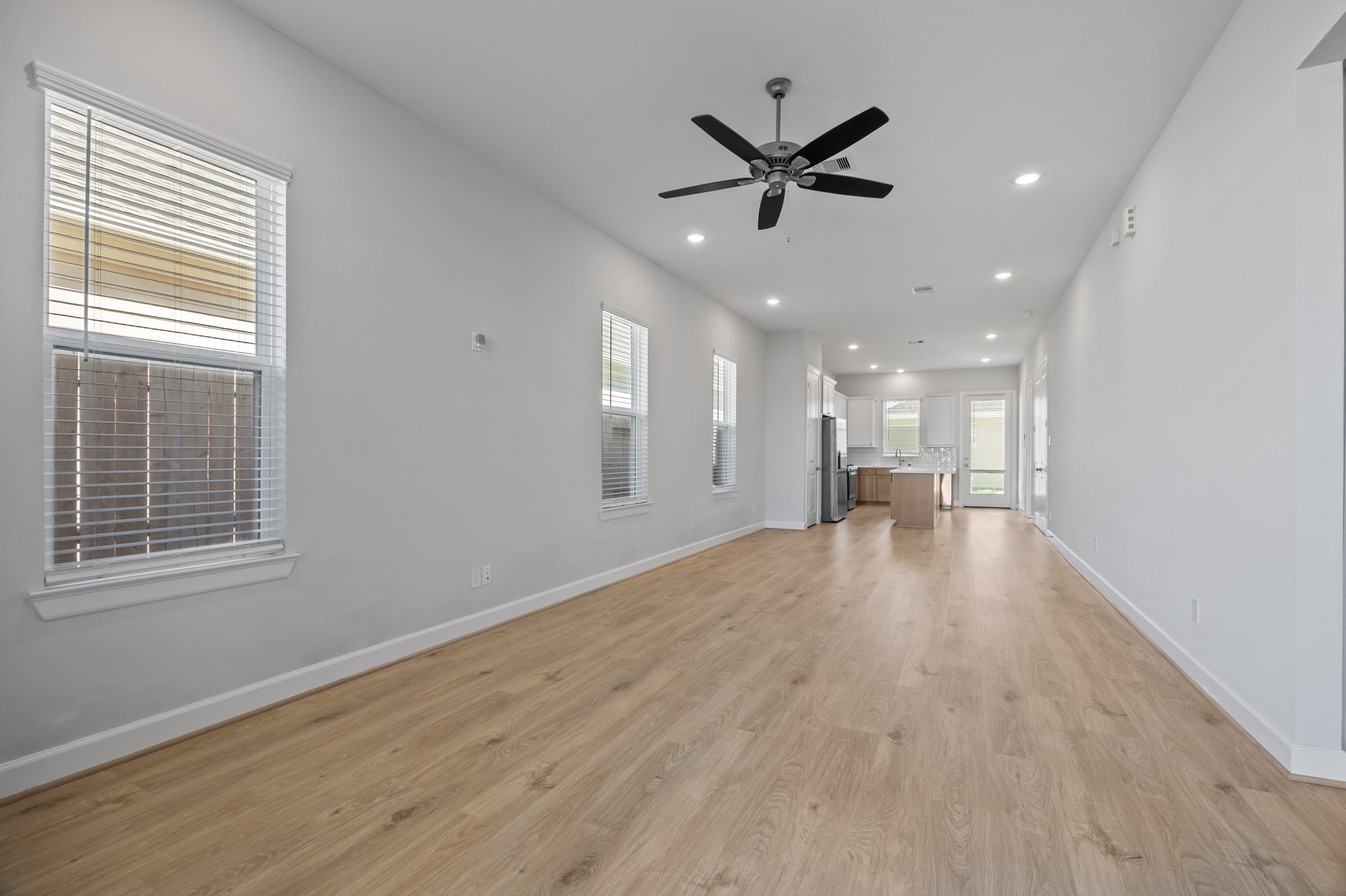 2505 South Houston Avenue Pearland, TX 77581 - Photo 4 of 24 a view of a livingroom with a ceiling fan and window