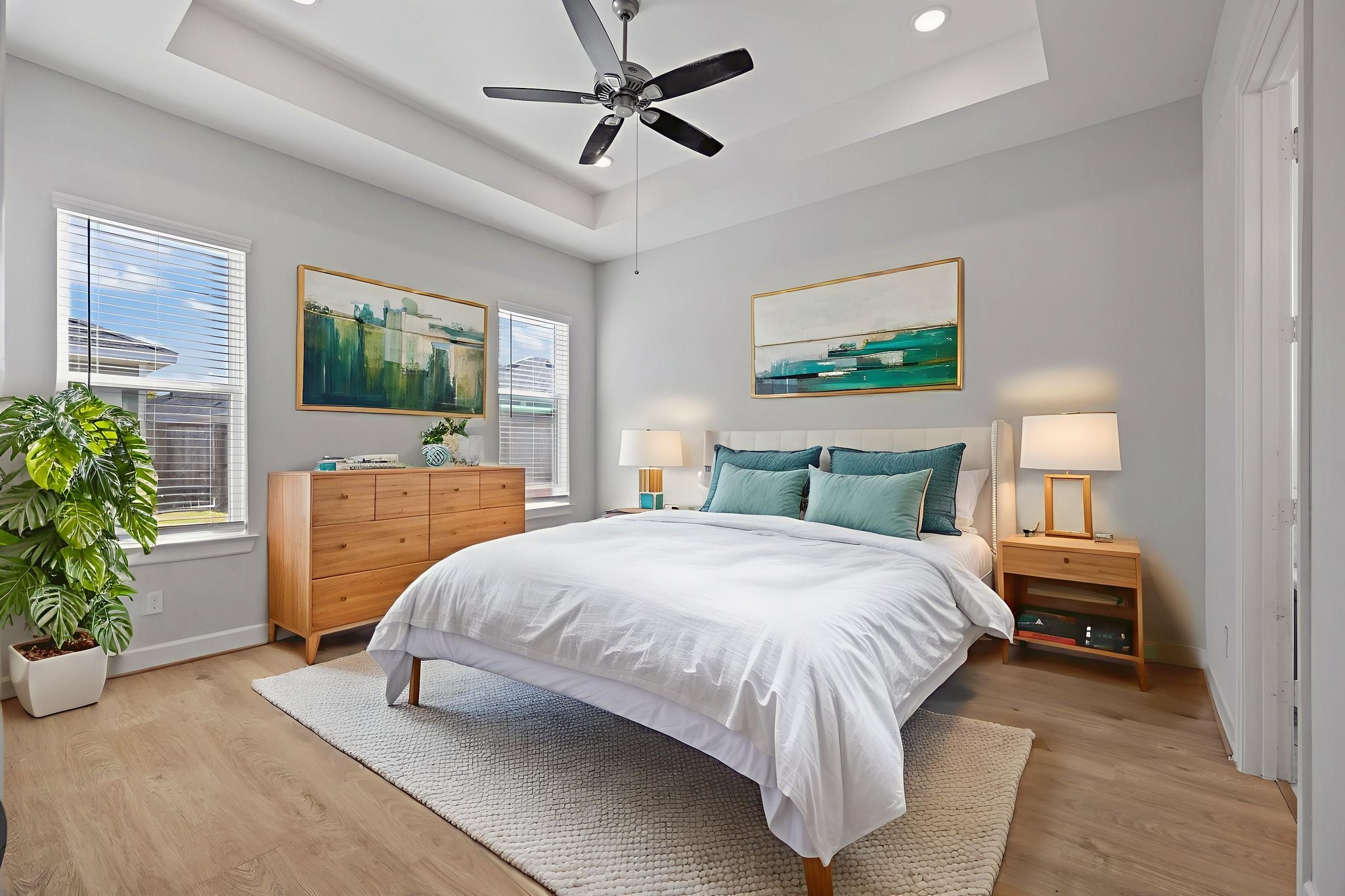 2505 South Houston Avenue Pearland, TX 77581 - Photo 7 of 24 a bedroom with a large bed and a flat screen tv