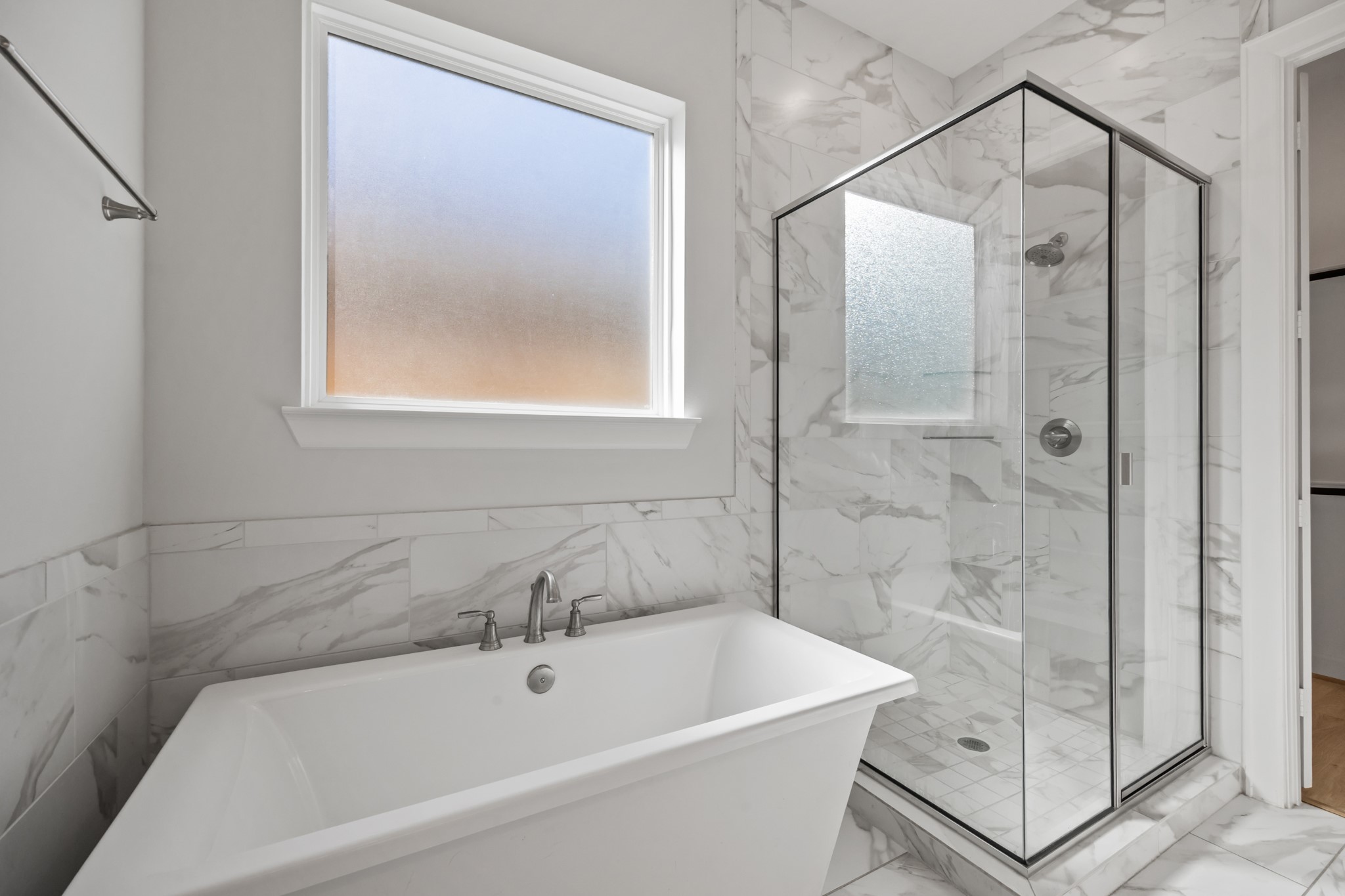 2505 South Houston Avenue Pearland, TX 77581 - Photo 9 of 24 a bathroom with a bathtub and a shower