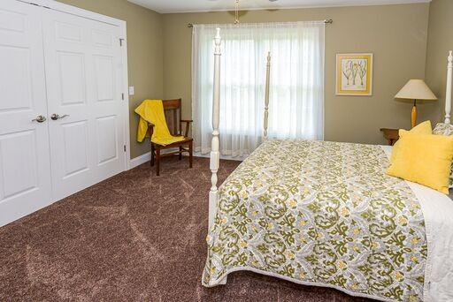 228 Wabash Road Fayetteville, TN 37334 - Photo 18 of 50 a bedroom with a bed and chair