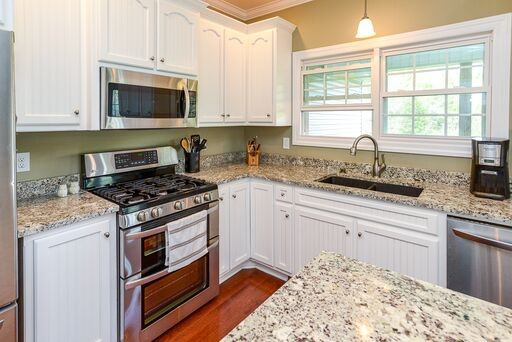 228 Wabash Road Fayetteville, TN 37334 - Photo 24 of 50 a kitchen with stainless steel appliances granite countertop a stove a sink and a microwave