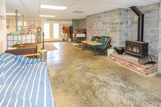 228 Wabash Road Fayetteville, TN 37334 - Photo 25 of 50 a living room with furniture stove and a fireplace
