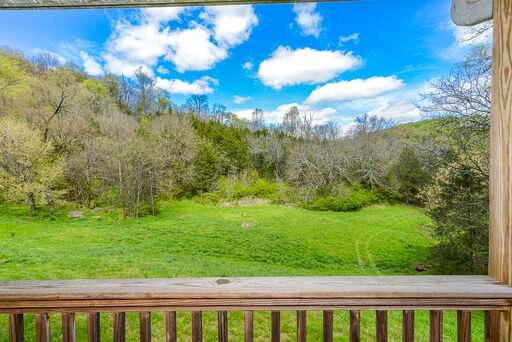 228 Wabash Road Fayetteville, TN 37334 - Photo 7 of 50 a view of a yard with a house in the background