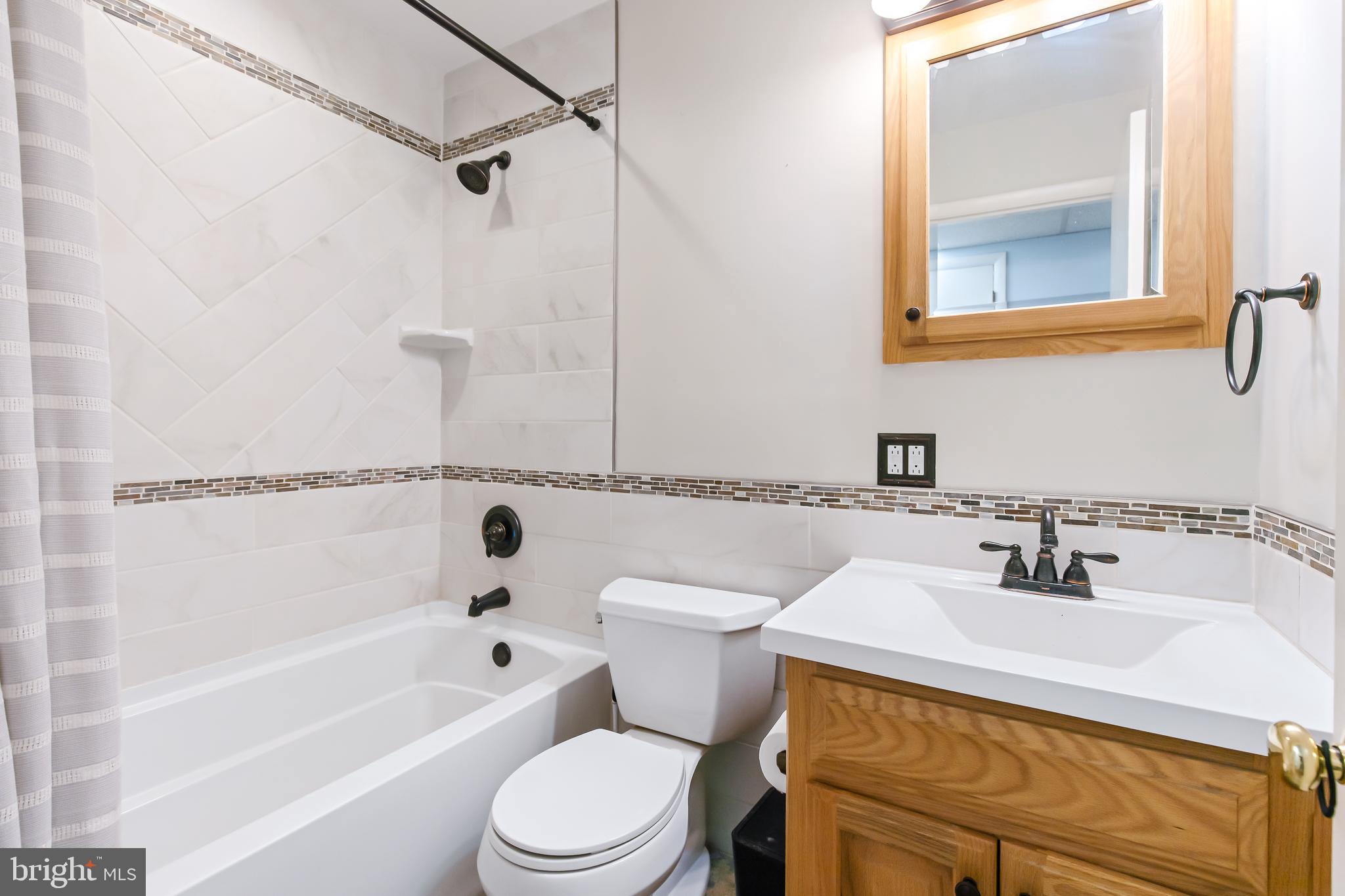 1749 Ramich Road Temple, PA 19560 - Photo 21 of 48 a bathroom with a sink a toilet and shower