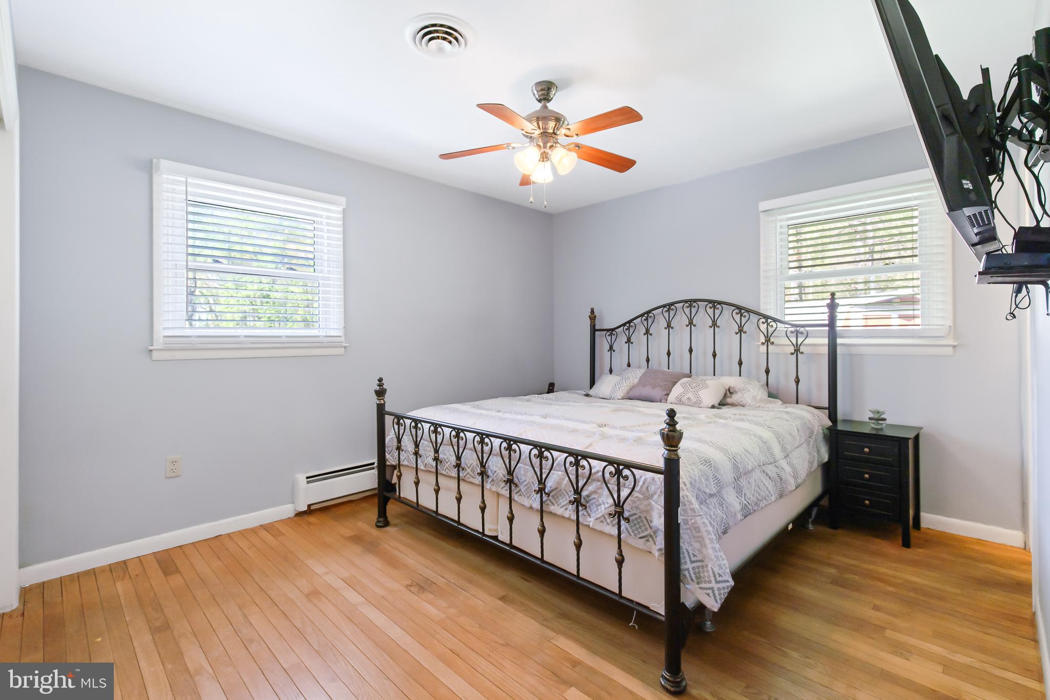 1749 Ramich Road Temple, PA 19560 - Photo 23 of 48 a bedroom with a bed and a chandelier