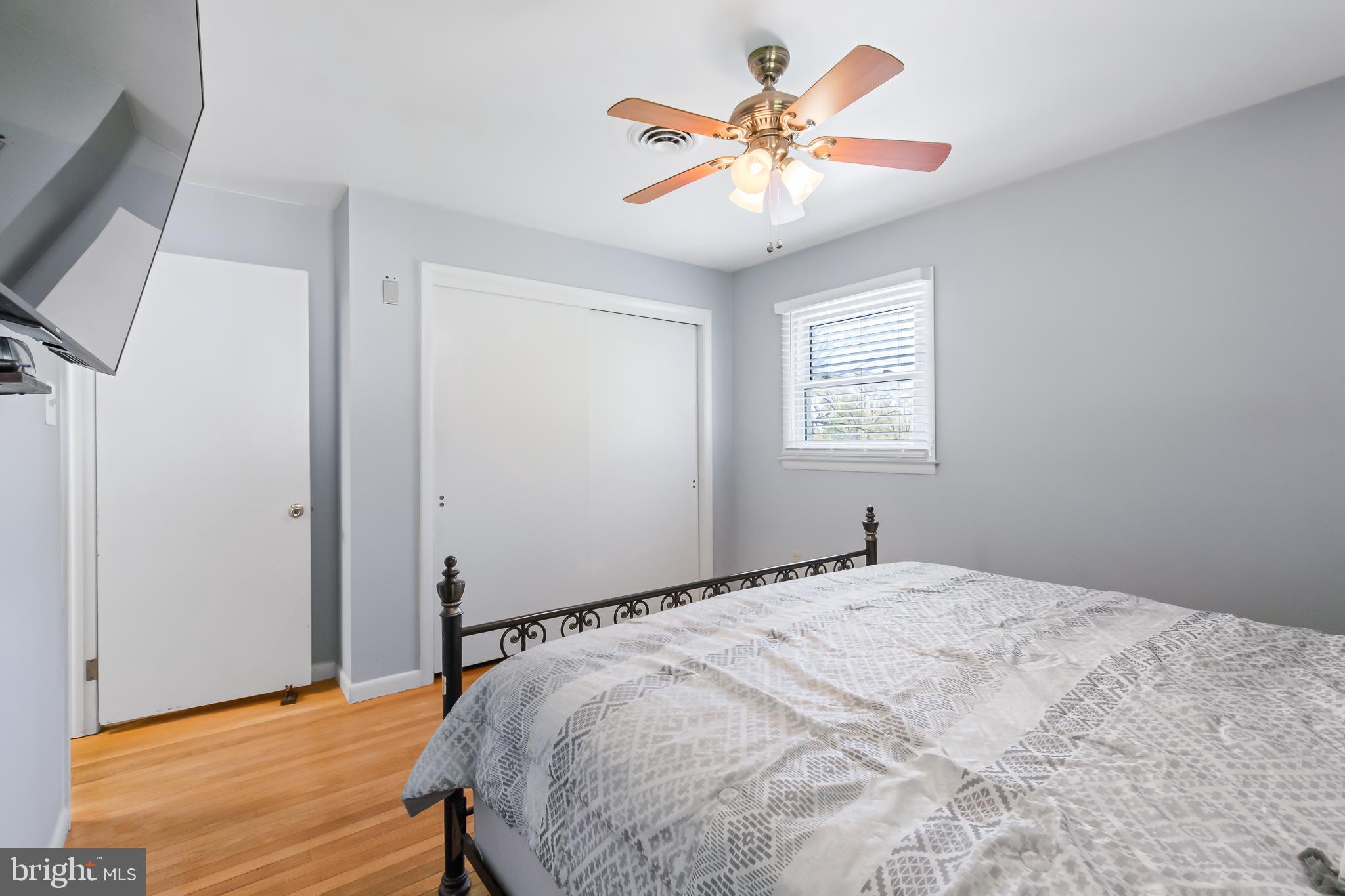 1749 Ramich Road Temple, PA 19560 - Photo 24 of 48 a bedroom with a bed and a chandelier